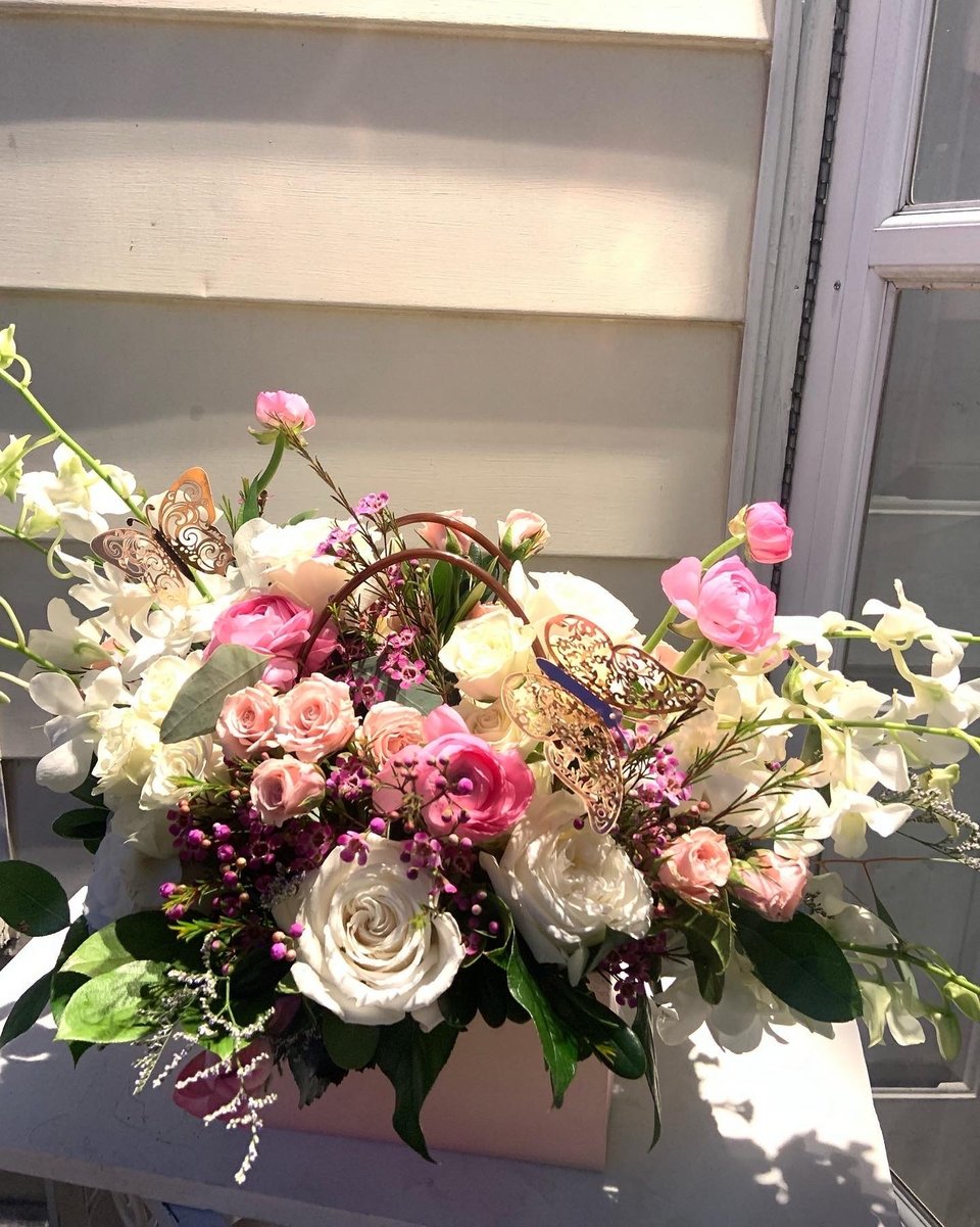 Pink and white arrangement in a box
