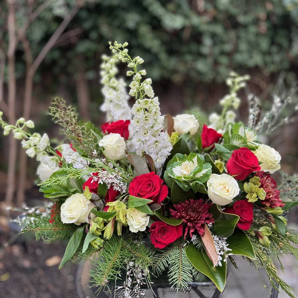 Red and white arrangement with delphinium and greenery
