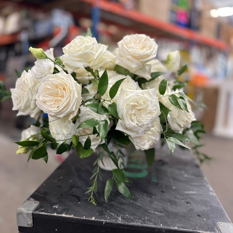 White garden roses with greenery