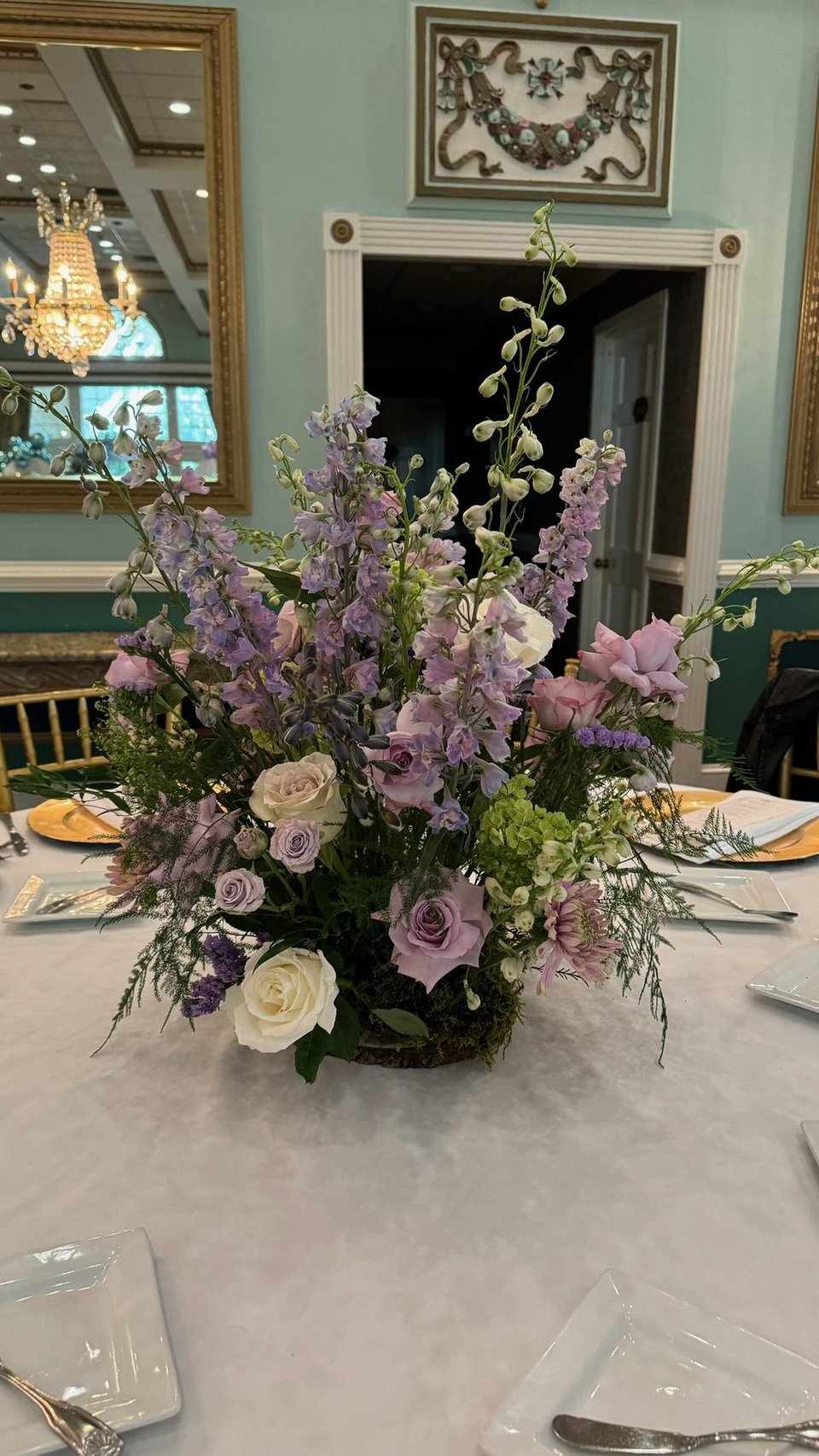 Lavender and white centerpiece on a round table