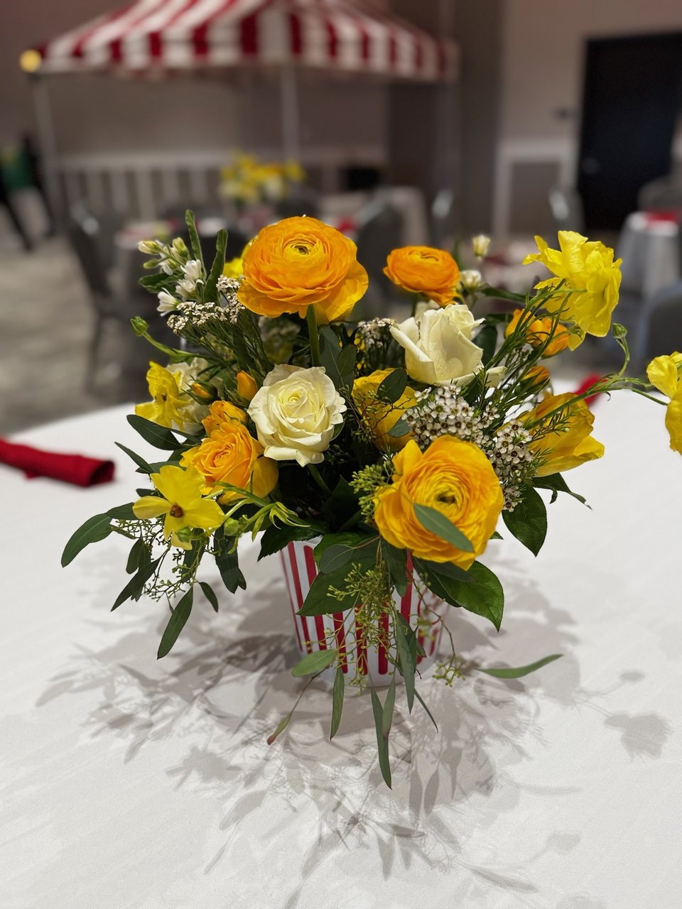 Yellow and orange ranunculus arrangement