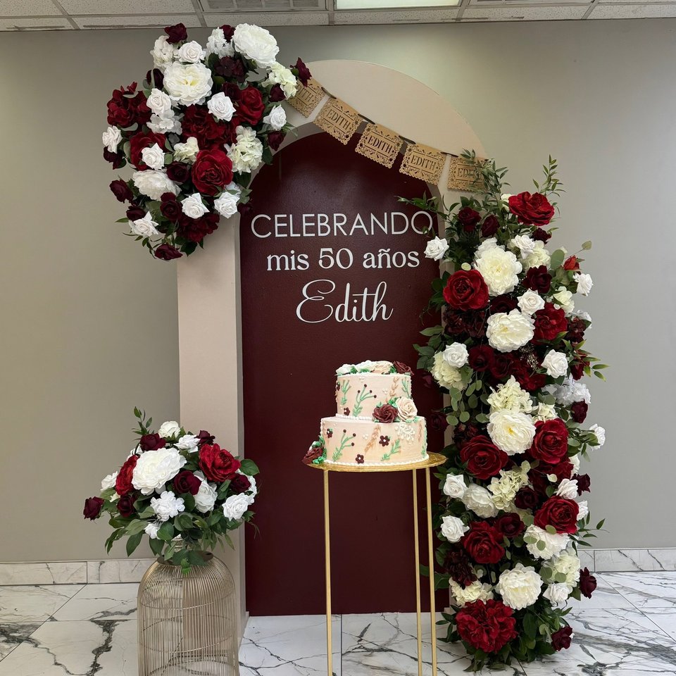 50th birthday backdrop with burgundy and white roses