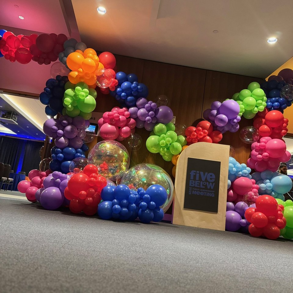 Colorful balloon installation with a Five Below sign
