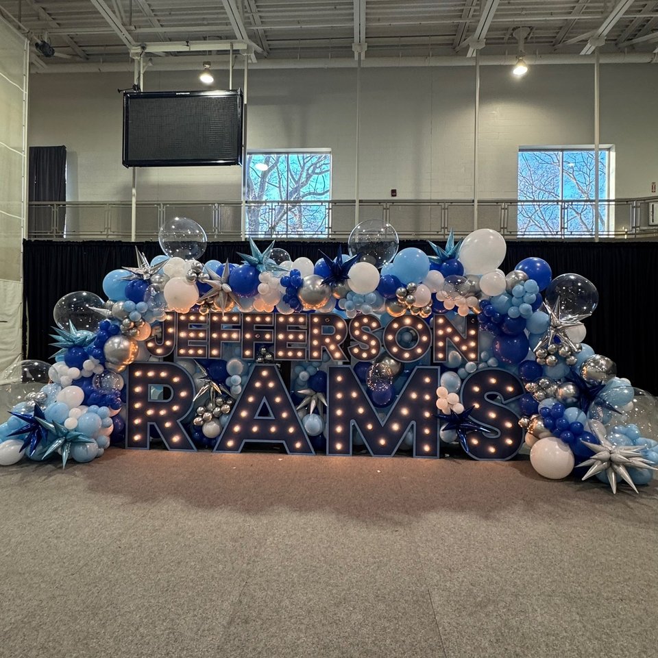 RAMS marquee letters with blue and white balloons