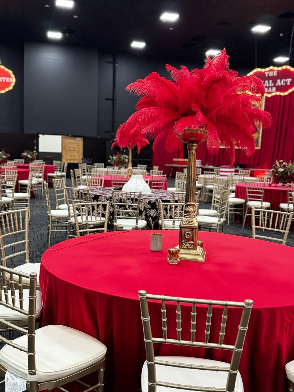 Red feather centerpiece on a red table