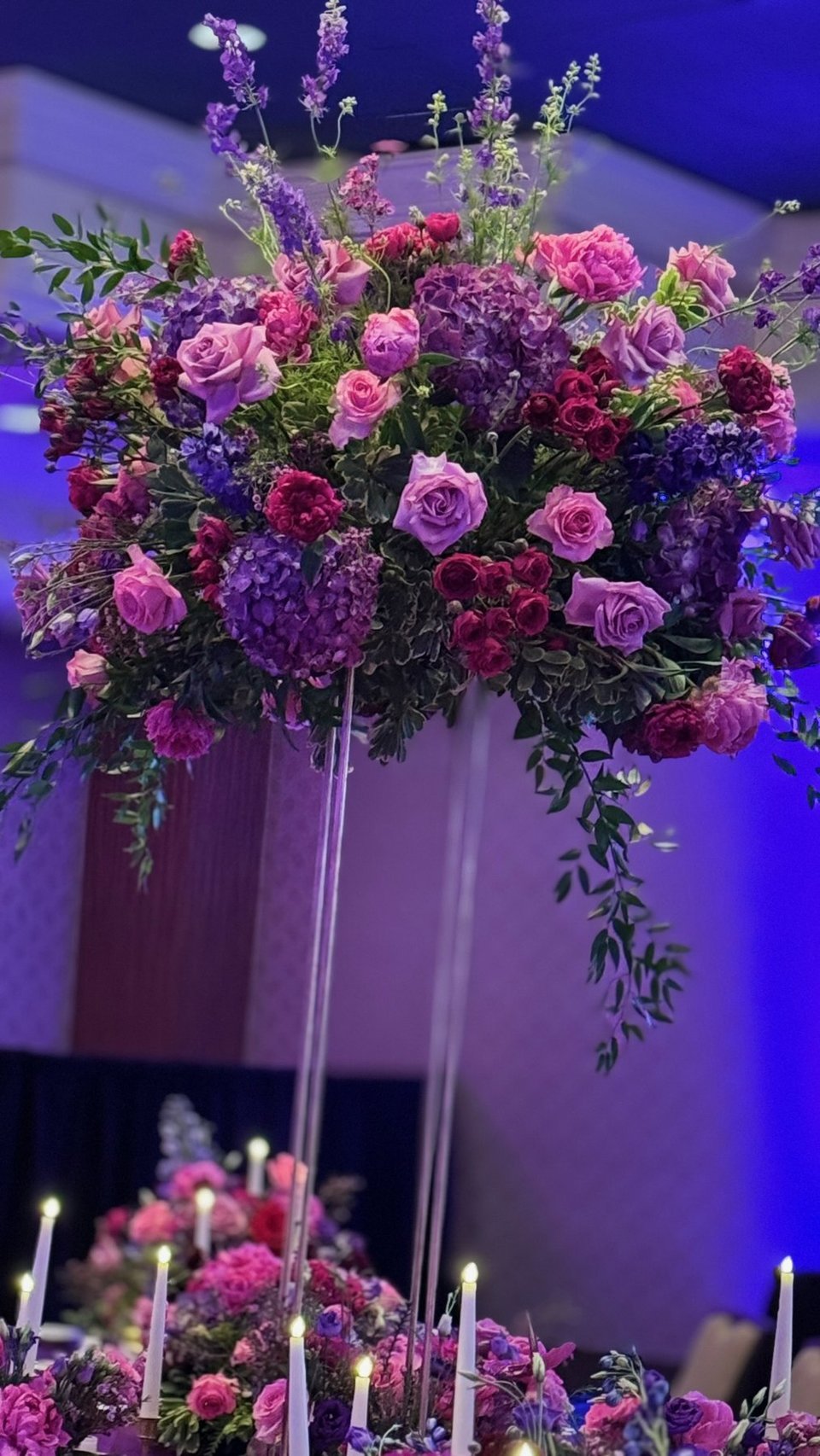 Tall pink and purple rose arrangement