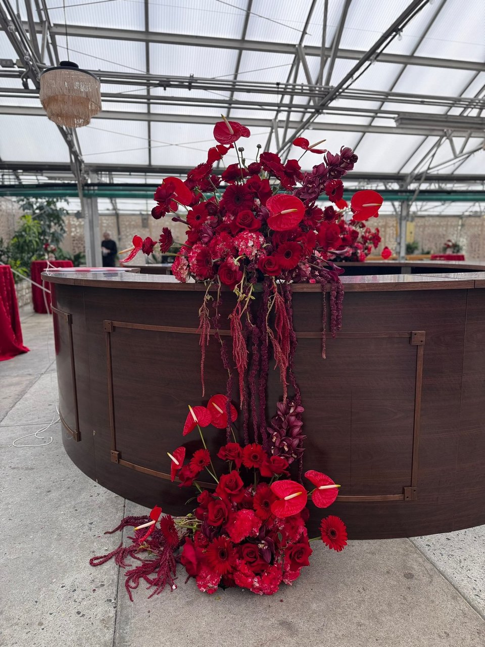 Red anthurium installation at a round bar