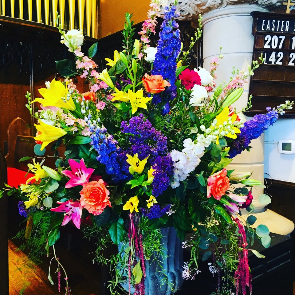 Easter arrangement with lilies and delphinium