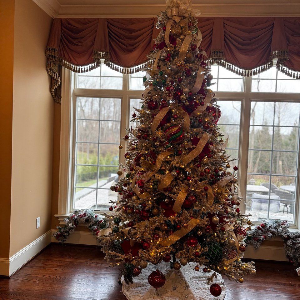 Christmas tree decorated in gold and burgundy