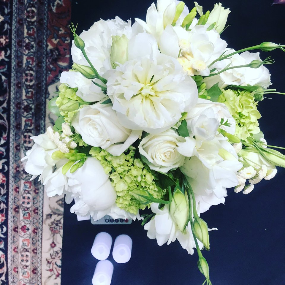 White bouquet with roses, lisianthus, and hydrangea