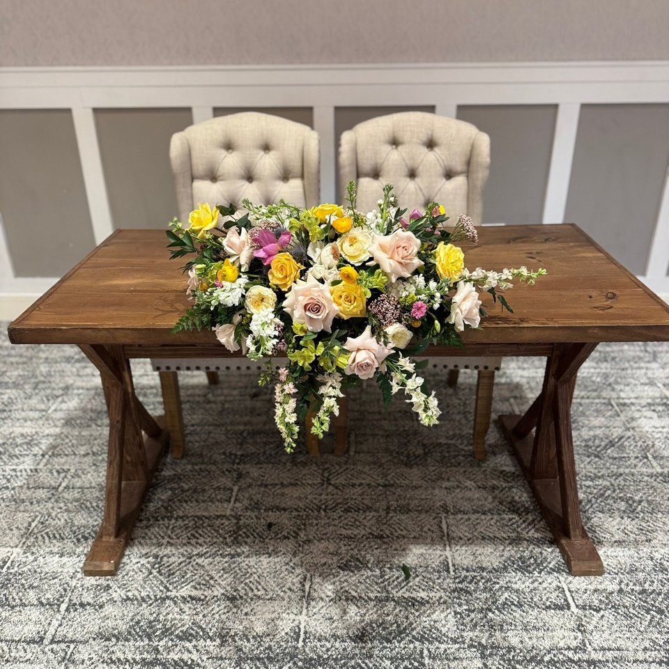 Sweetheart table with a garden-style arrangement