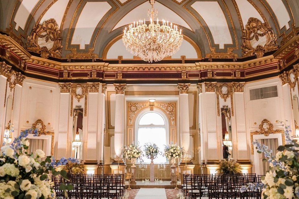 Gilded ballroom set for a reception